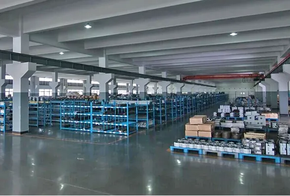 Organized factory parts storage warehouse with industrial shelving and components