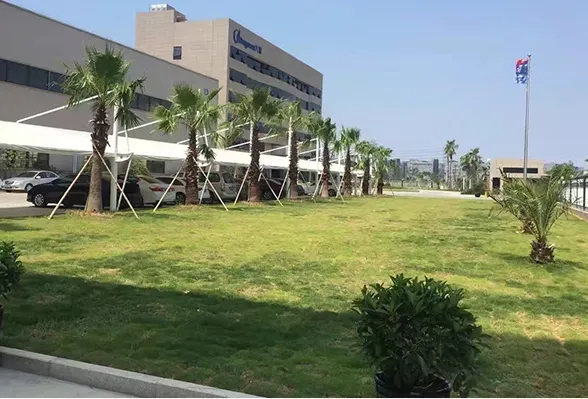 Exterior view of Dayuan manufacturing facility, showing the modern factory building and green campus