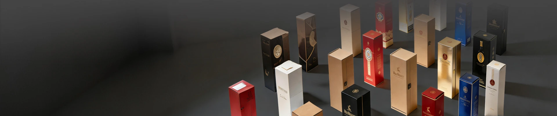 Collection of luxury wine and spirits packaging boxes made with premium die-cutting and foil stamping